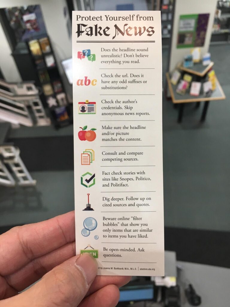 Flyer that says Protect Yourself from Fake News with a list of evaluation criteria.