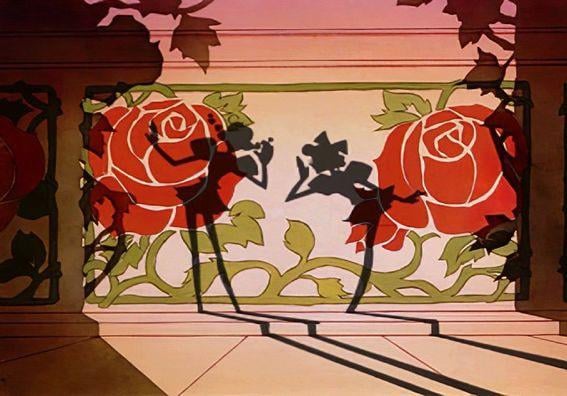 Illustration of two shadow puppets foregrounded against a rose-decorated wall.